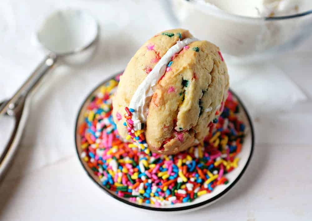 Birthday Cake Cookies Being Rolled in Sprinkles