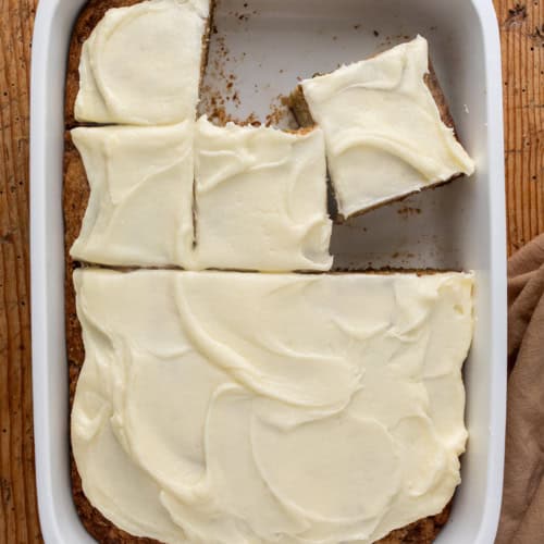 Pan of Zucchini Cake with Some Pieces Cut and Removed.