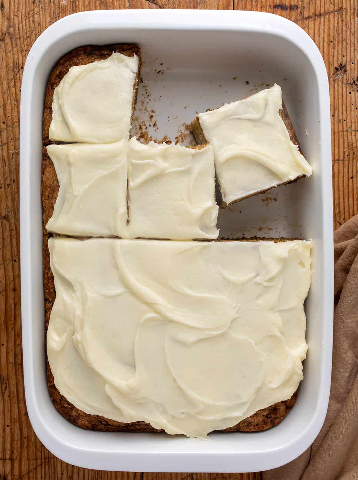 Pan of Zucchini Cake with Some Pieces Cut and Removed.