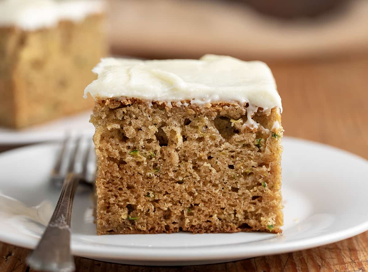 Piece of Zucchini Cake on a White Plate.