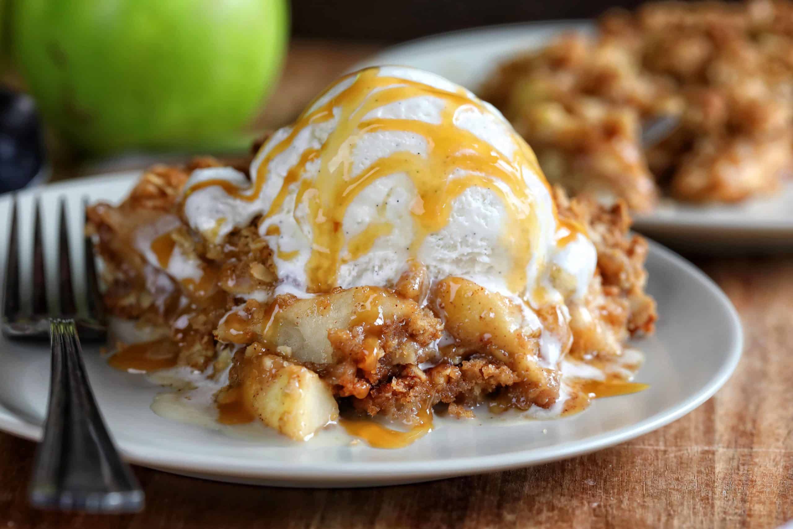 The Best Apple Crisp on Plate with Fork and Ice Cream