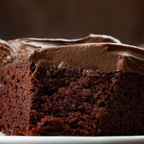 Close up of Chocolate Mayo Cake with a Corner Section Removed.