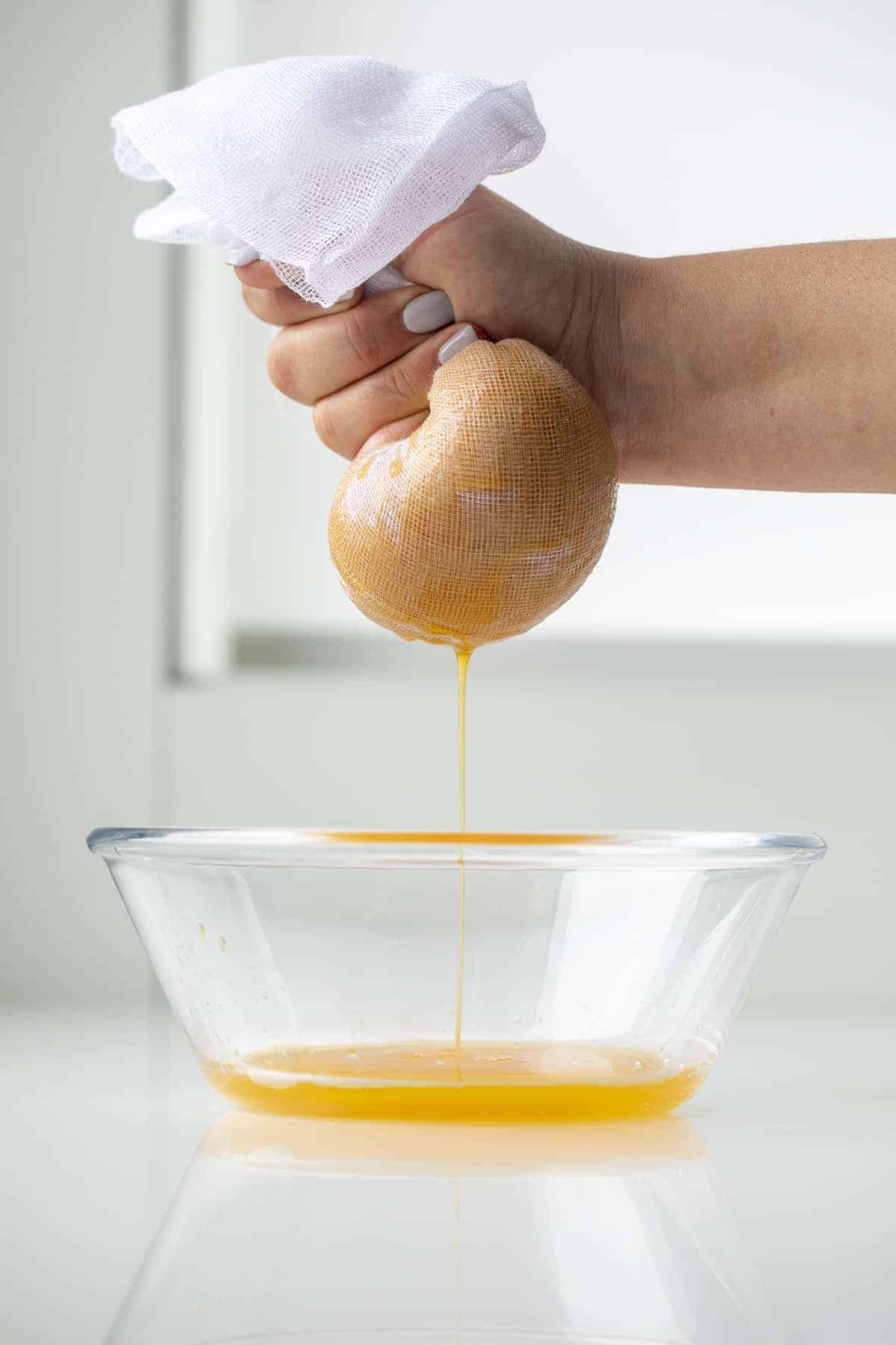 Draining Pumpkin Puree with Cheesecloth for Pumpkin Snickerdoodle Cookies