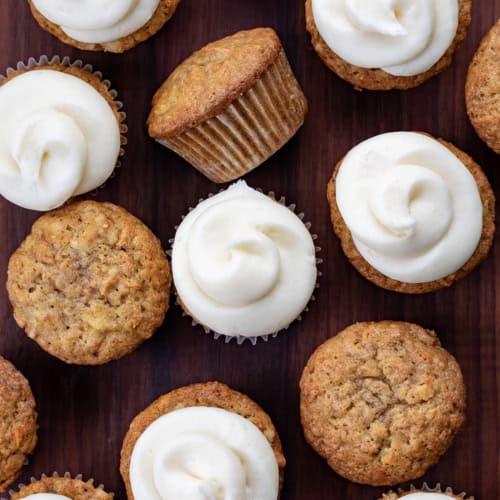 Looking down over Carrot Cake Cupcake Some with Cream Cheese Frosting and Some Without.