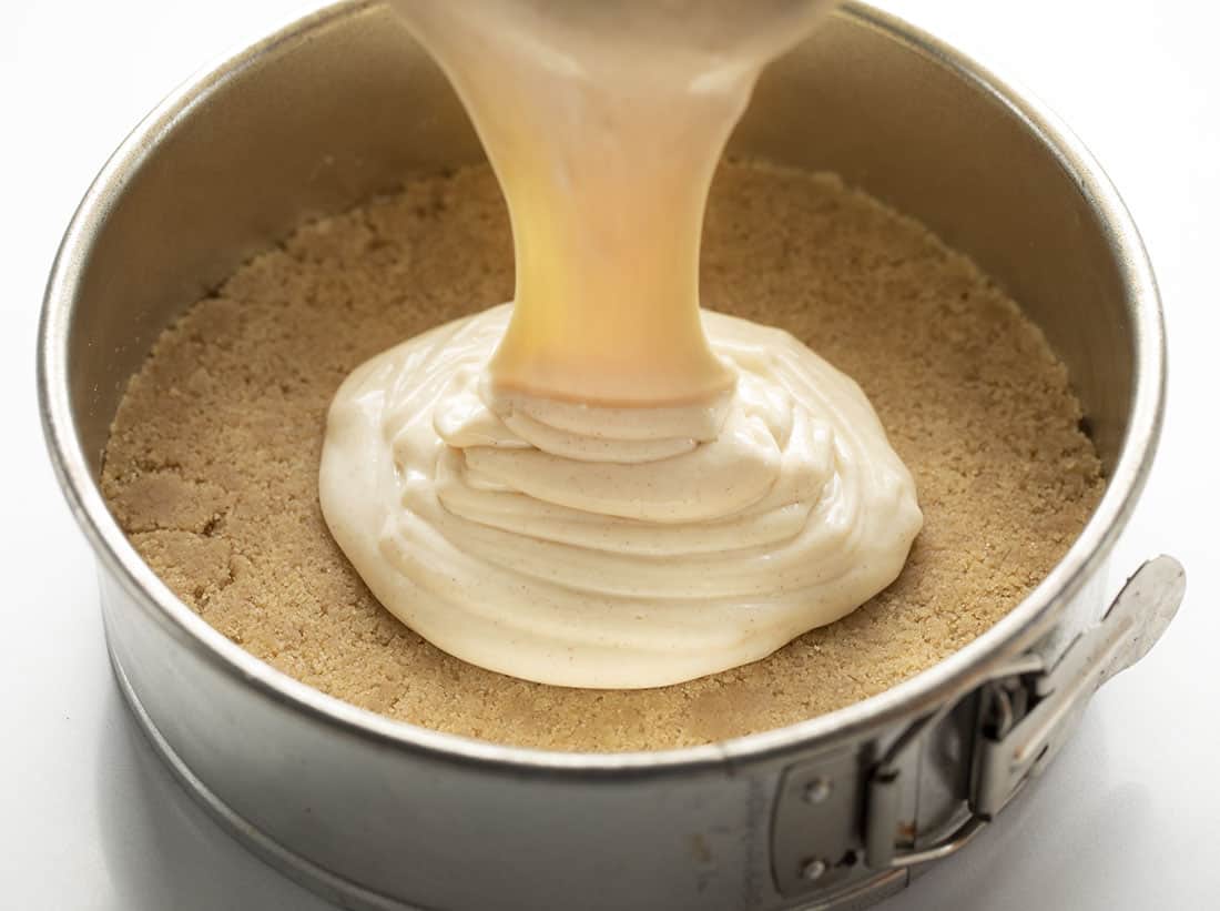 Pouring Snickerdoodle Cheesecake into Springform Pan