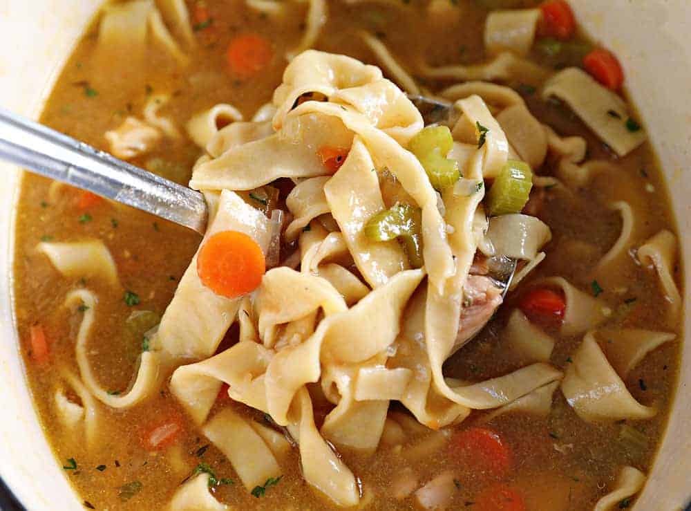 Chicken Noodle Soup Being Scooped Out of Pot