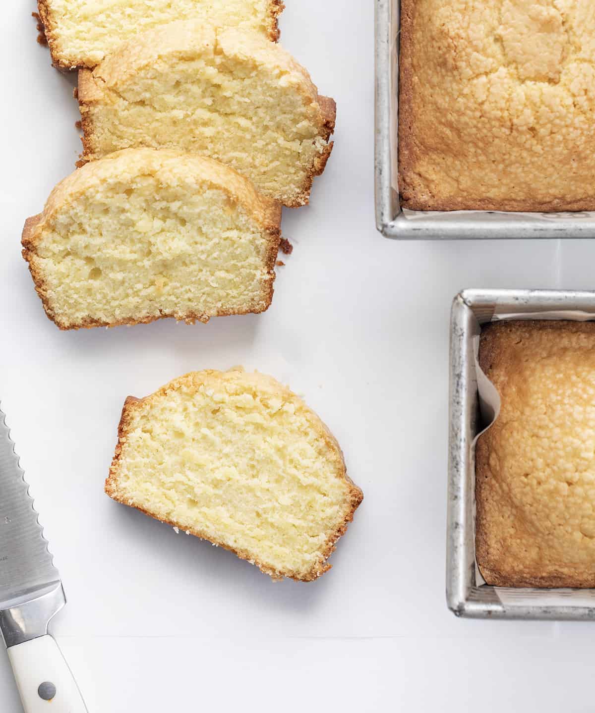 Slices of Vanilla Pound Cake next to Other Loaves. Dessert, Cake, Pound Cake, Vanilla Pound Cake, Loaf Cake, Loaf Pound Cake, Vanilla Cake, Old Fashioned Cake Recipes, Original Vanilla Pound Cake, No Vanilla Extract Cake, recipes, iambaker, i am baker