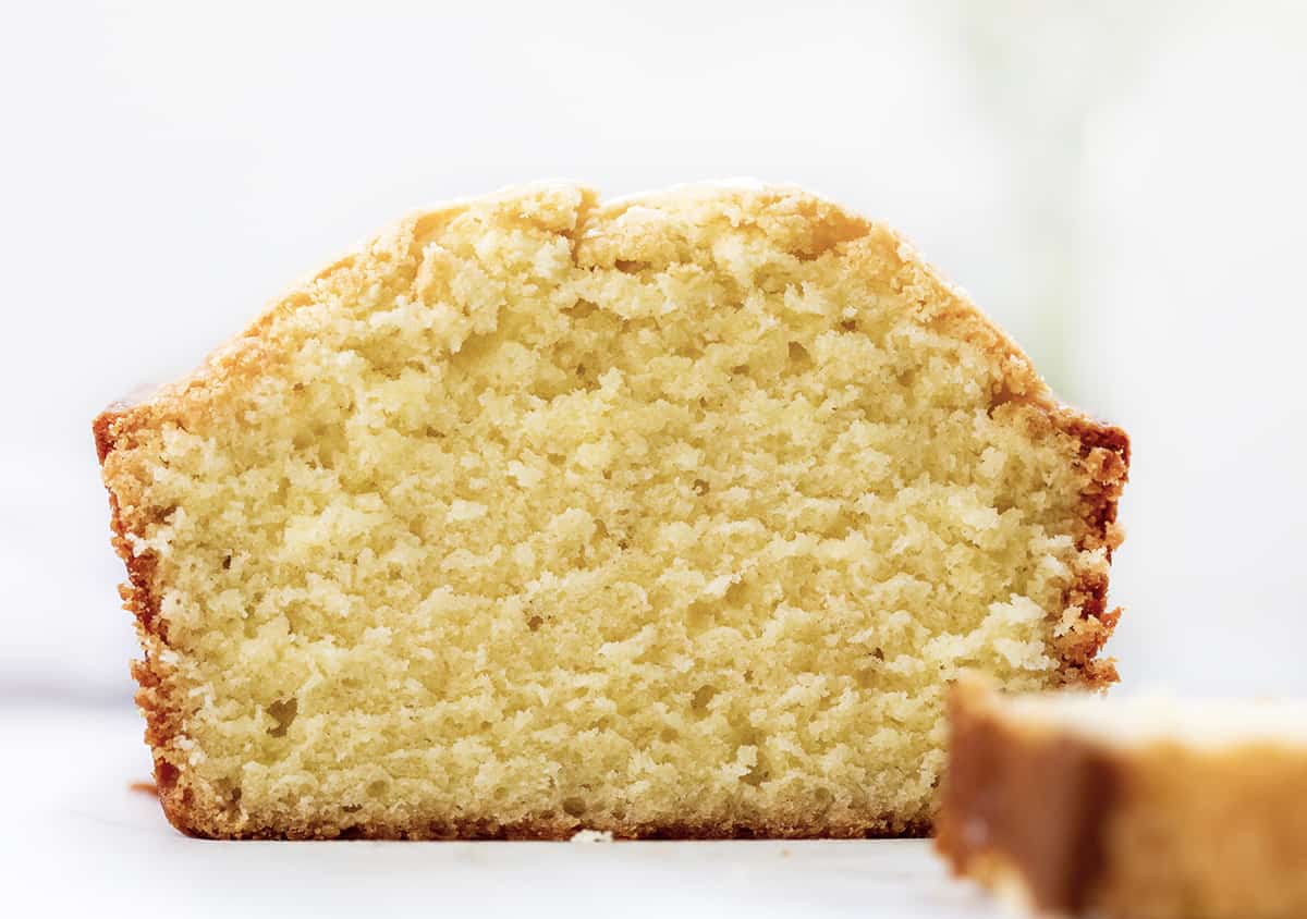 Close up of a Loaf of Vanilla Pound Cake That Has Been Cut. Dessert, Cake, Pound Cake, Vanilla Pound Cake, Loaf Cake, Loaf Pound Cake, Vanilla Cake, Old Fashioned Cake Recipes, Original Vanilla Pound Cake, No Vanilla Extract Cake, recipes, iambaker, i am baker