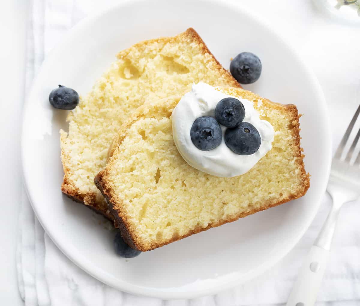 Two Pieces of Vanilla Pound Cake on a Plate. Dessert, Cake, Pound Cake, Vanilla Pound Cake, Loaf Cake, Loaf Pound Cake, Vanilla Cake, Old Fashioned Cake Recipes, Original Vanilla Pound Cake, No Vanilla Extract Cake, recipes, iambaker, i am baker