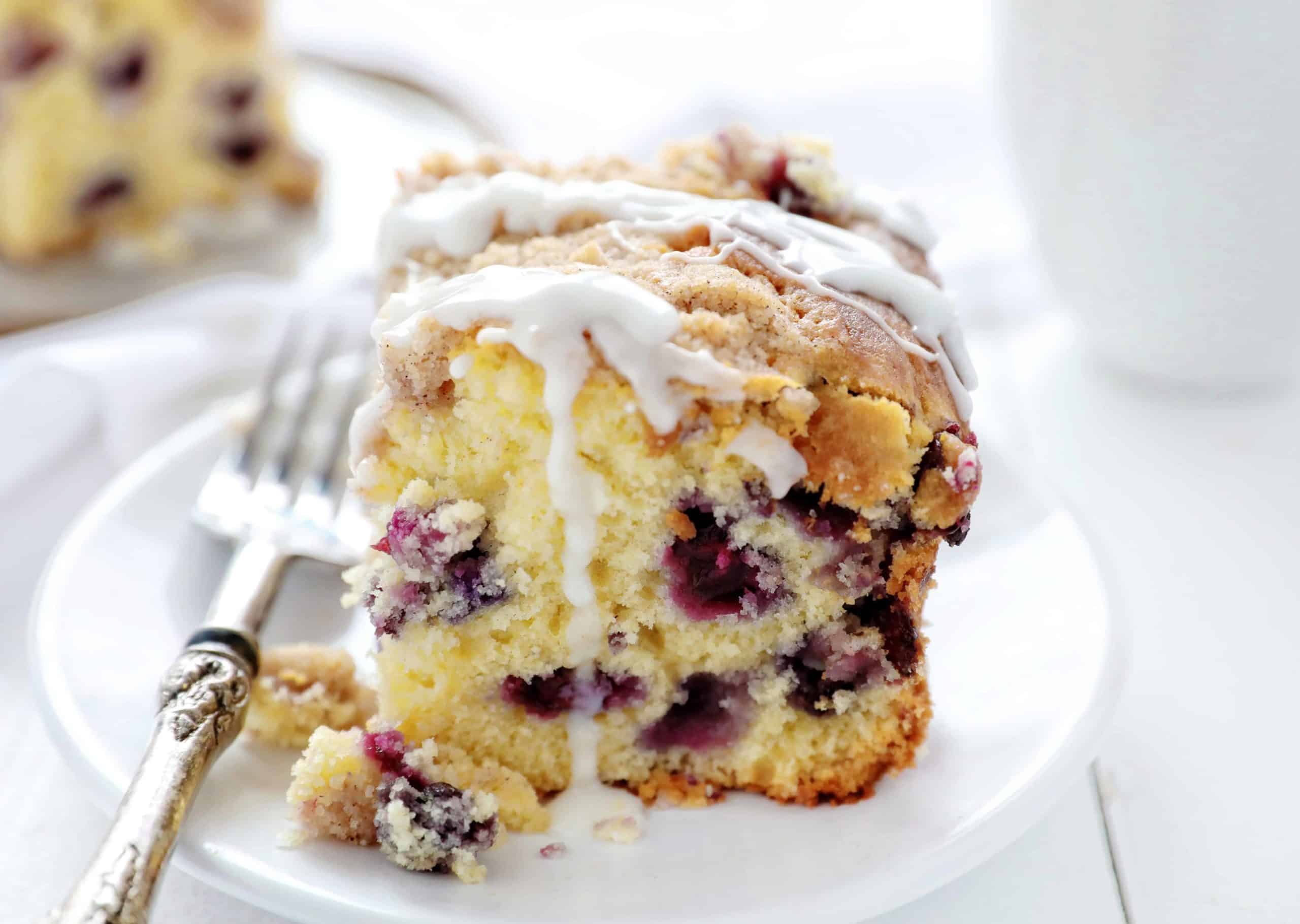 Blueberry Breakfast Cake or Coffee Cake on White Plate with Fork