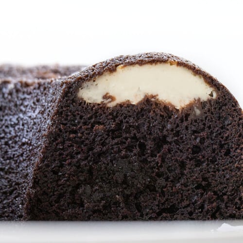 Sliced Into Chocolate Cream Cheese Bundt Cake Showing Inside Texture. Dessert, Baking, Chocolate, Chocolate Dessert, Bundt Cake, Cake, Cake Recipes, Filled Bundt Cake, Nothing but Bundts Cake, Baking Recipes, i am baker, iambaker