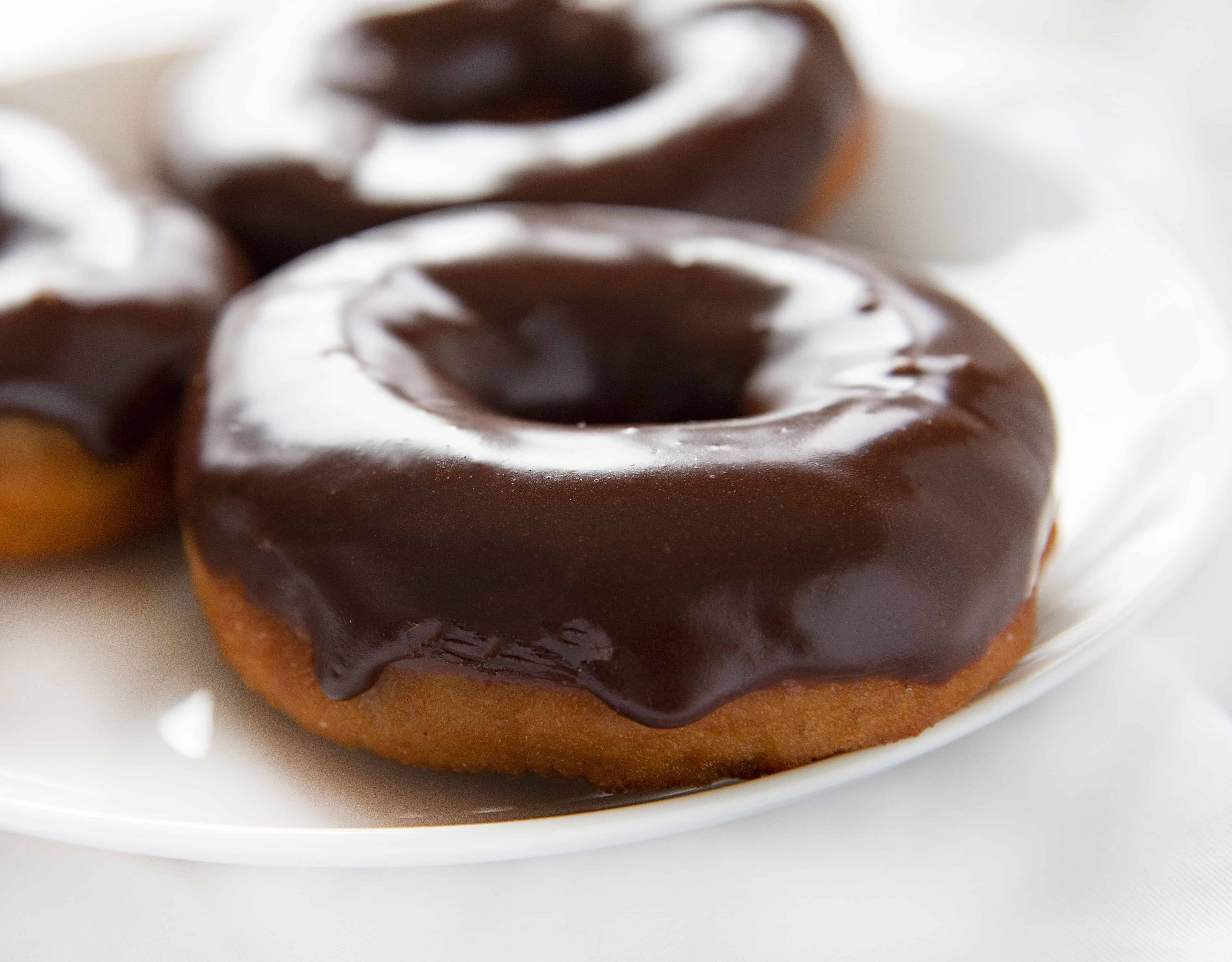 Chocolate Glazed Cake Donut on White Plate