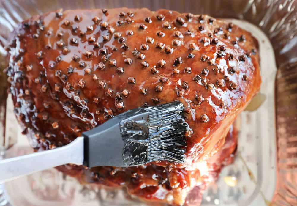 Raw Ham Being Glazed with Pastry Brush