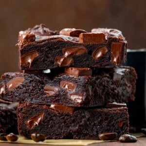 Stack of Mocha Brownies with Coffee Beans Around.