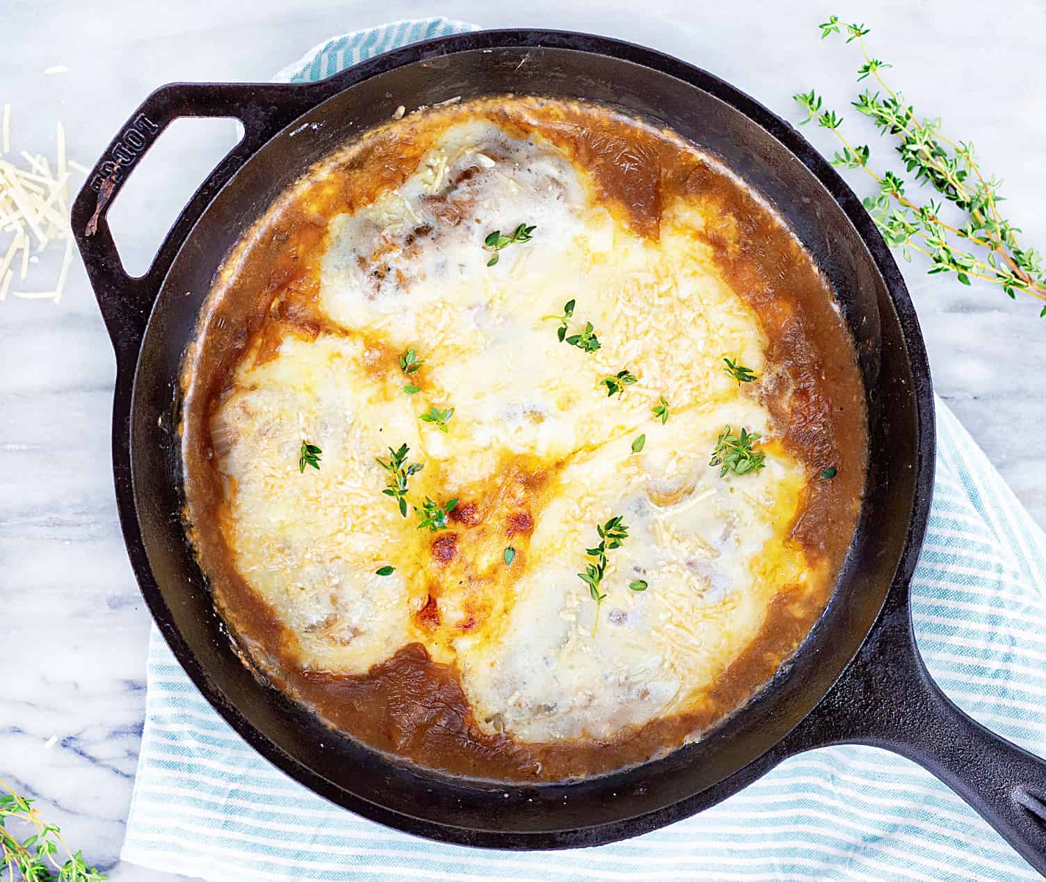 Skillet French Onion Chicken on Marble Background