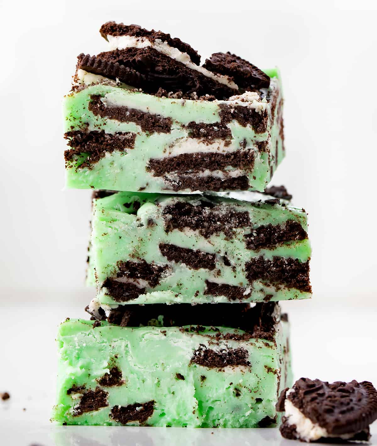 Stack of Mint Oreo Fudge Pieces on a White Counter.