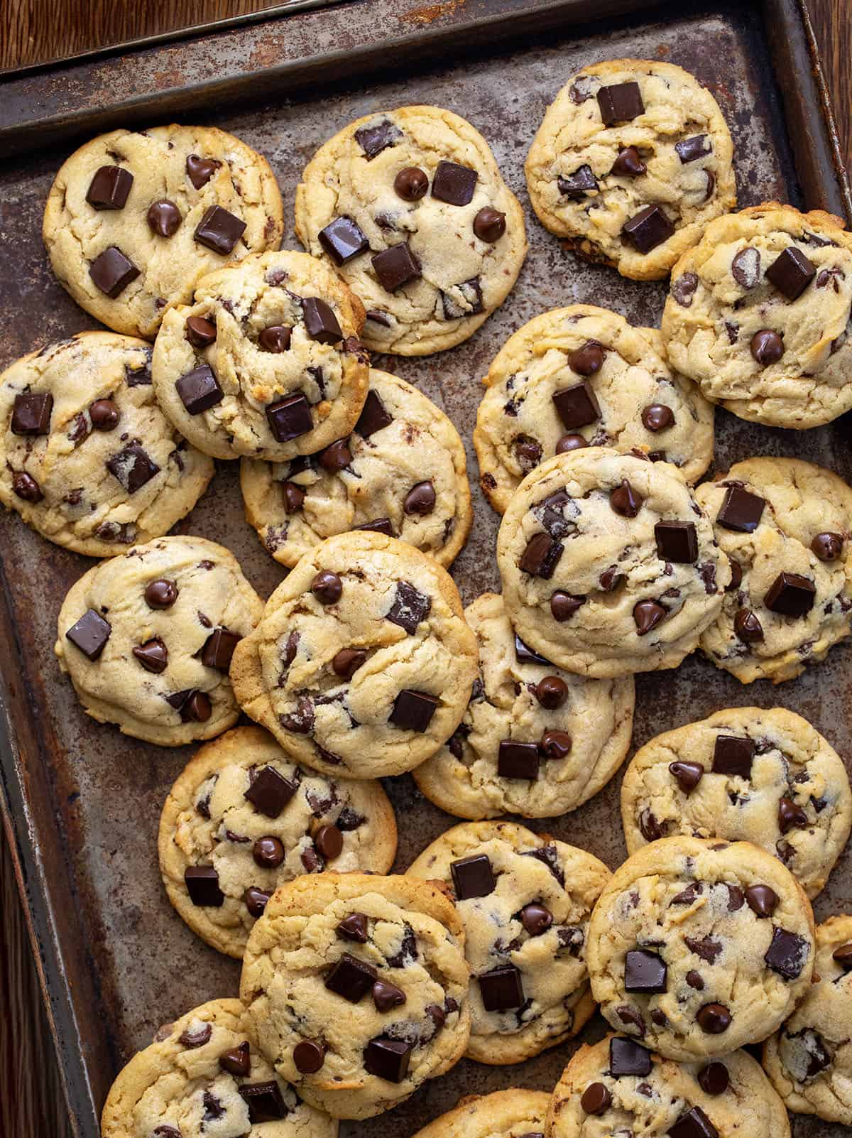 Pan of Chocolate Chip Cookies on a wooden table from overhead.