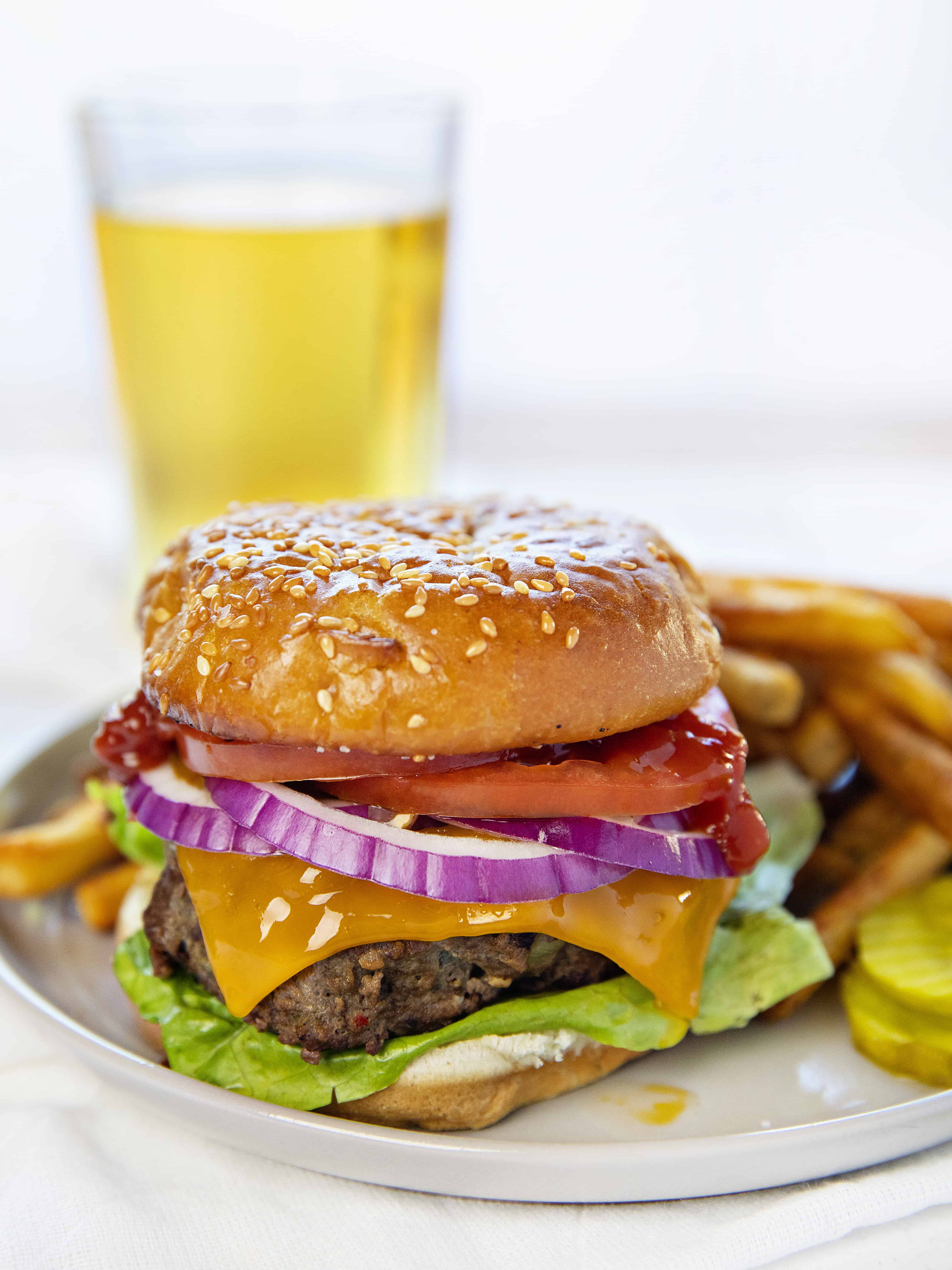 Classic Cheeseburger on a Plate with Beer