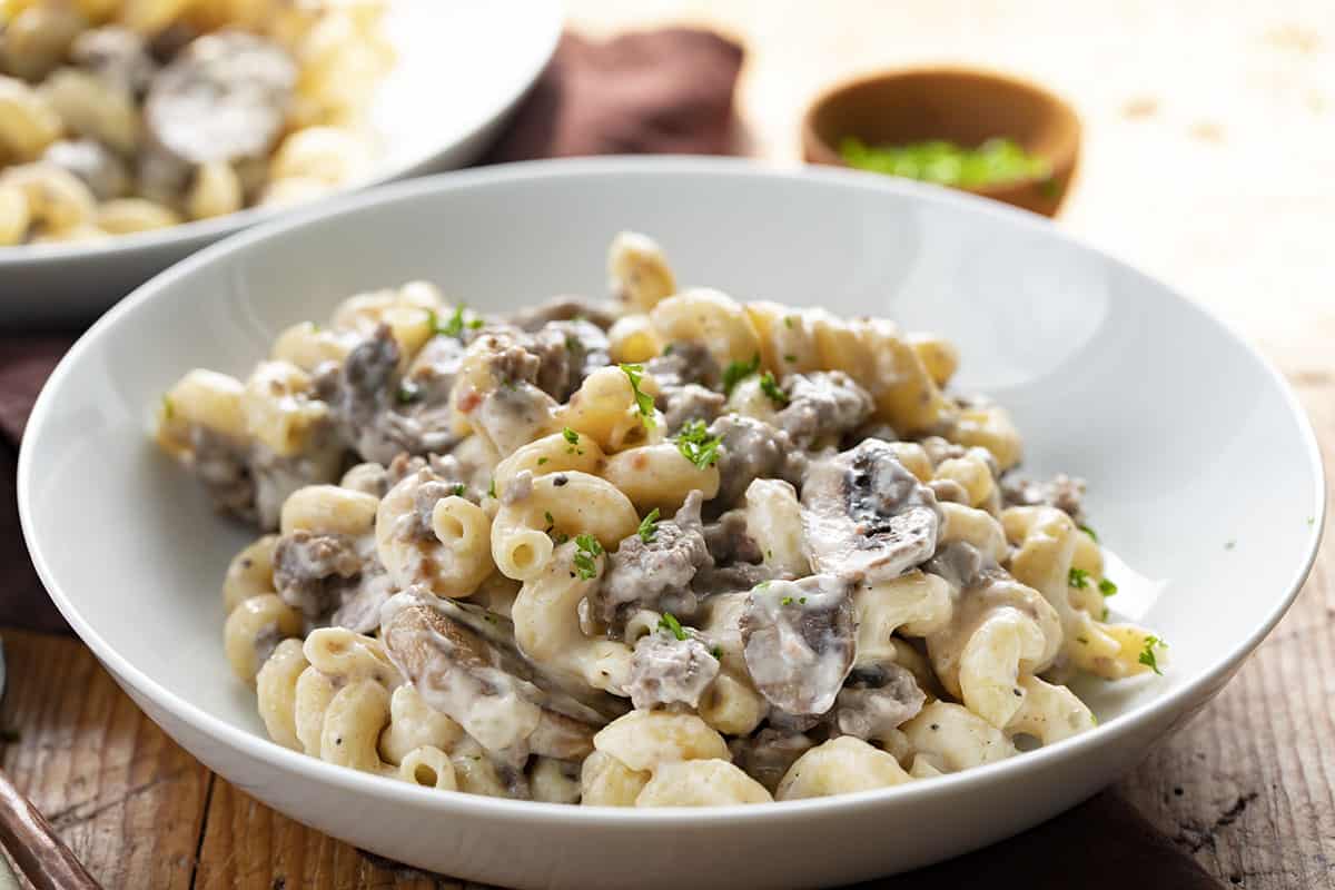 Bowl of Mushroom Swiss Pasta. Dinner, Supper, Mushroom Swiss Macaroni and Cheese, Mushroom Swiss Noodles, Easy Dinner Idea, Hamburger, Ground Beef Dinner Ideas, Ground Beef Recipes, i am baker, iambaker