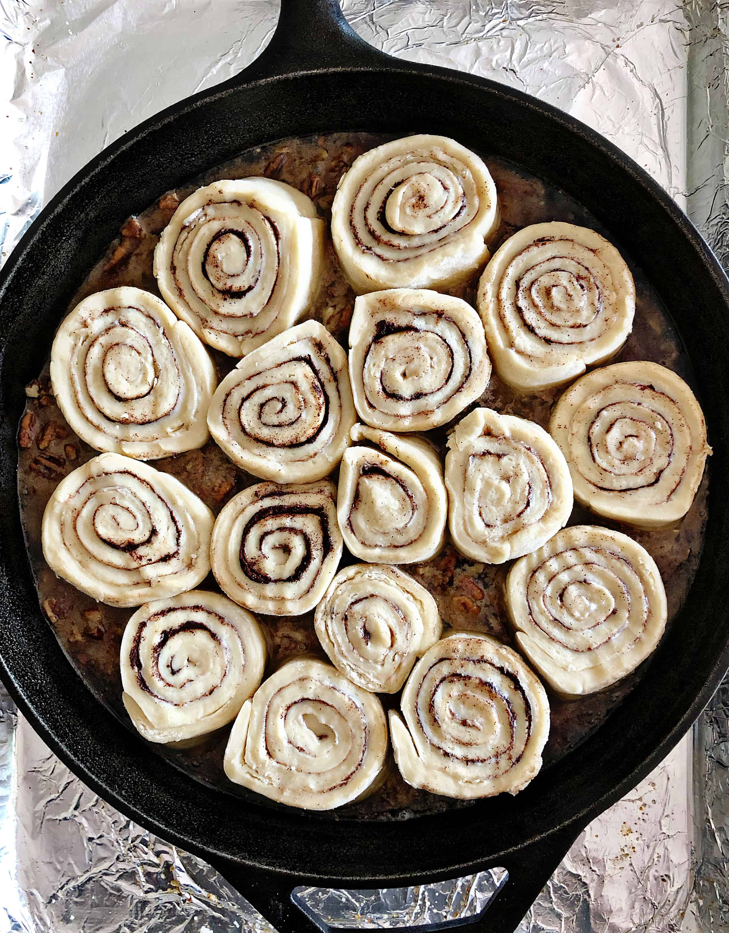 Overhead view of raw sticky buns before baking