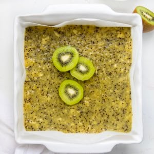 Pan of Kiwi Bars on a white table from overhead.