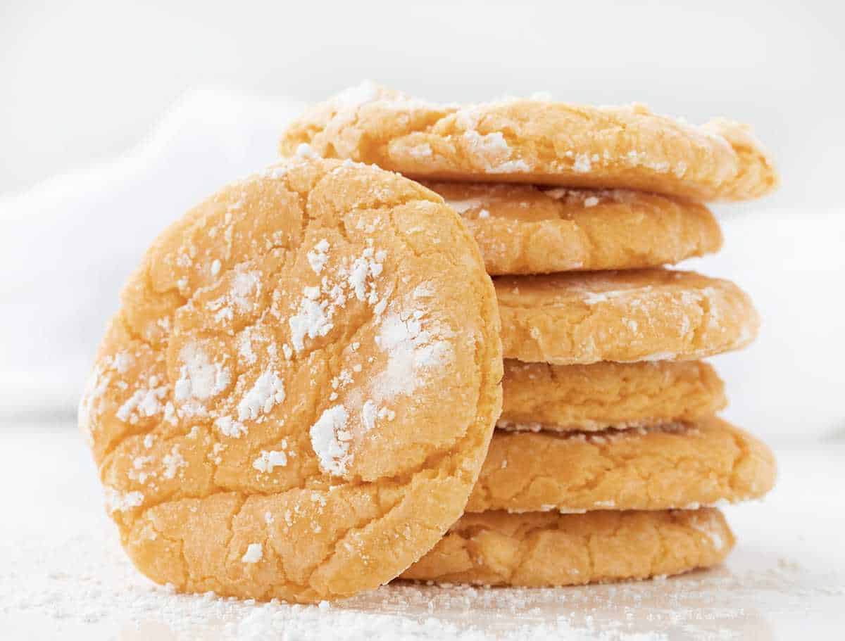 Stack of Orange Creamsicle Cookies with One Leaning Against Stack