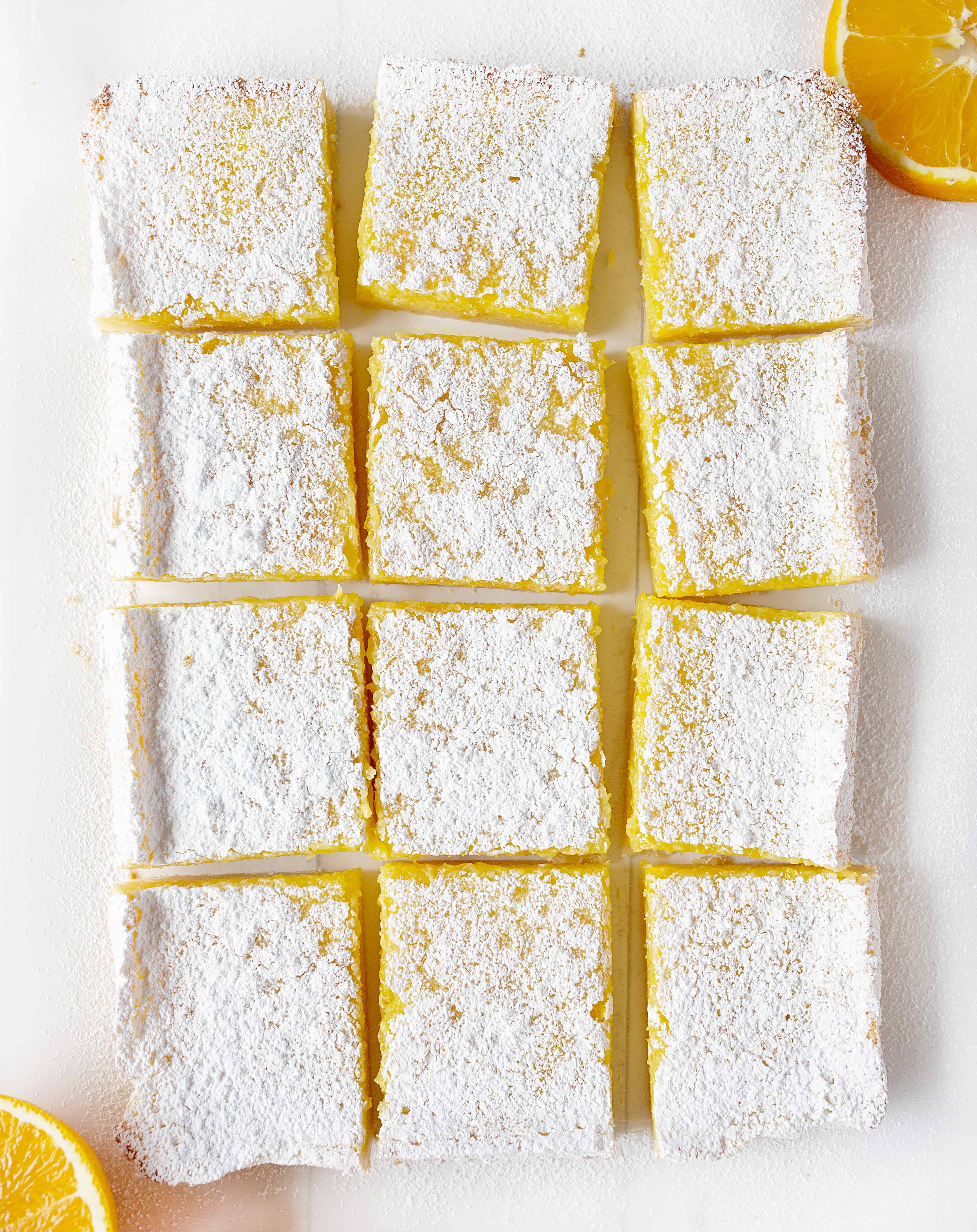 Orange Bars From OVerhead Cut Up Into Squares and dusted in Confectioners Sugar. 