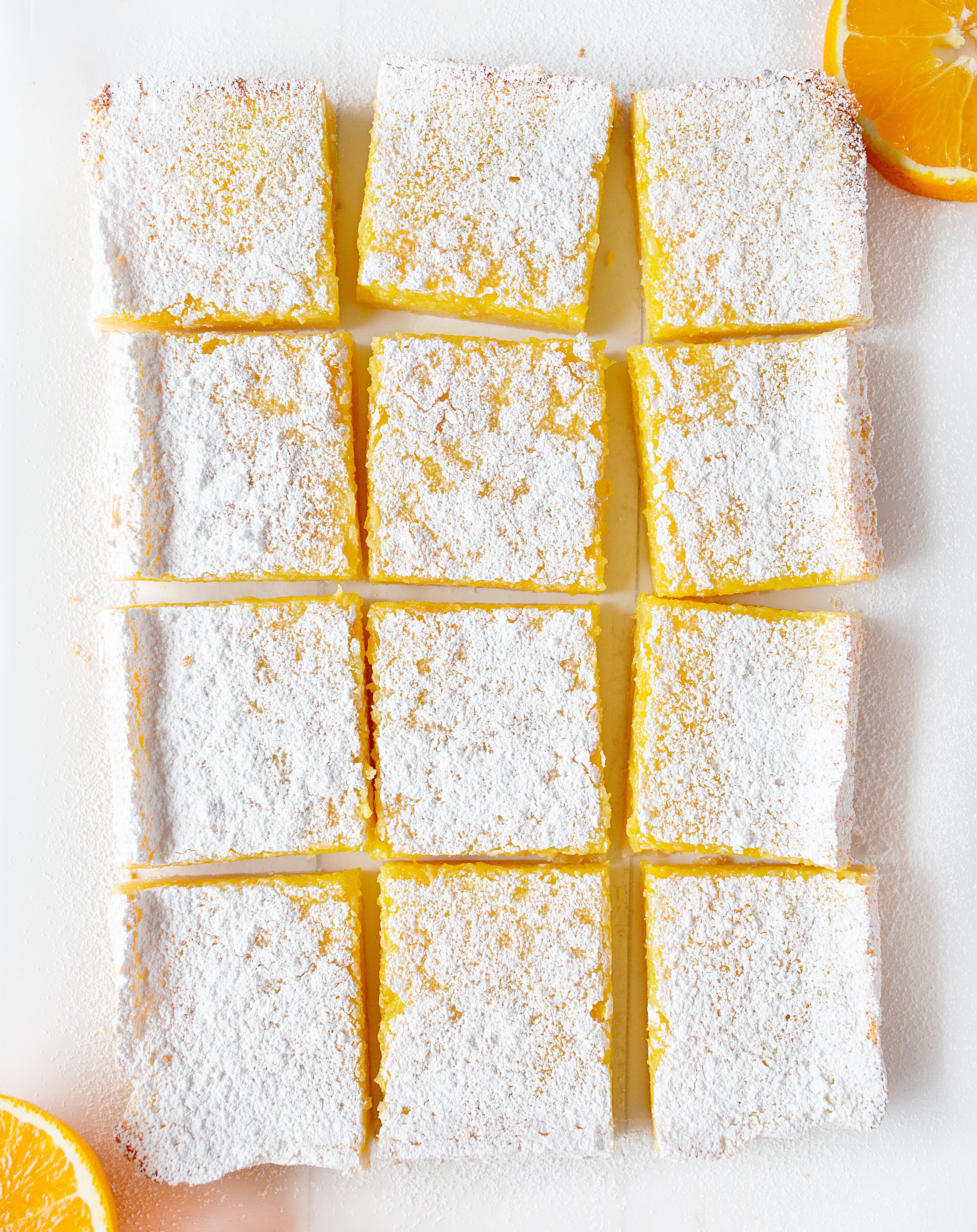 Orange Bars From OVerhead Cut Up Into Squares and dusted in Confectioners Sugar. 