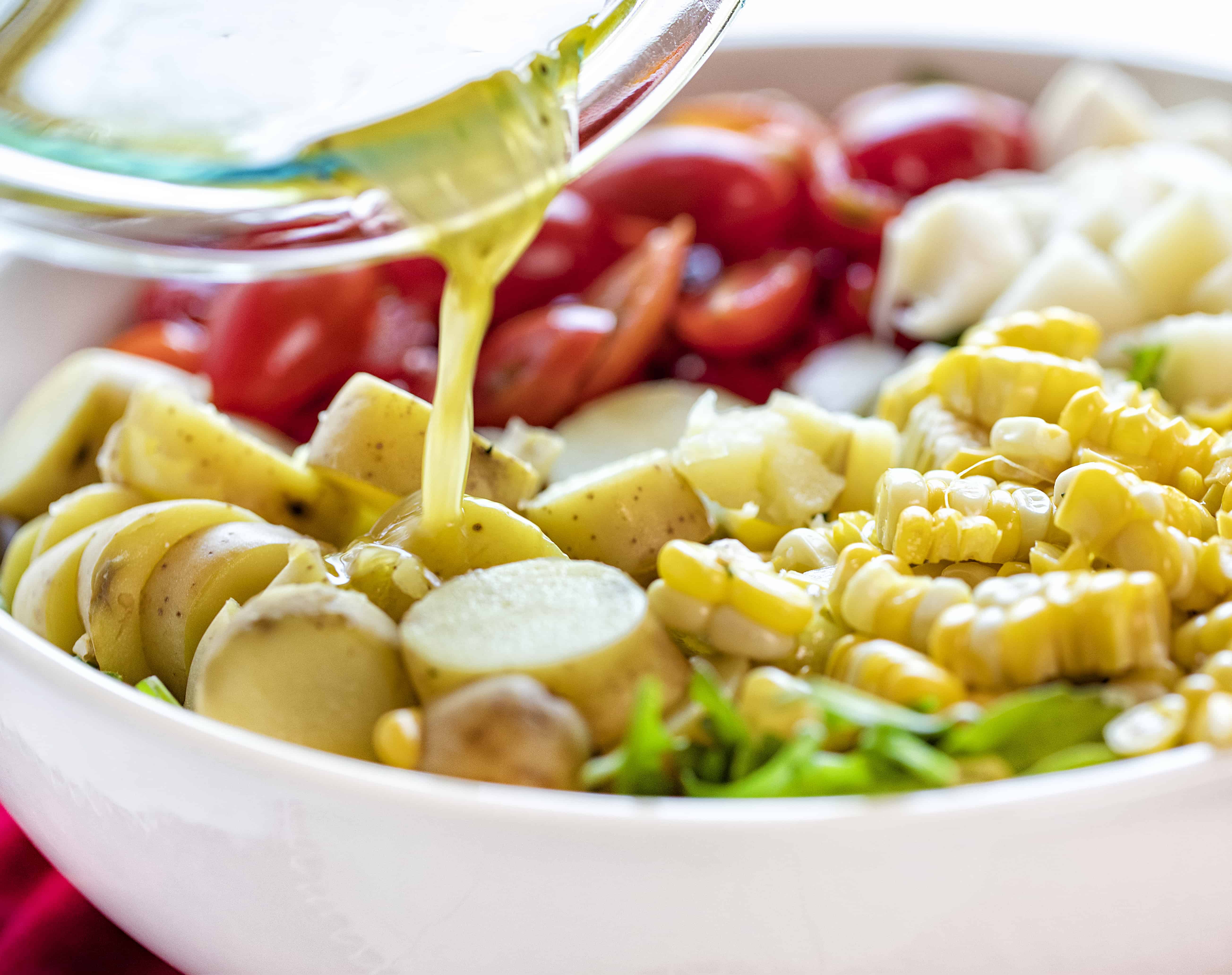 Pouring Vinaigrette on a Summer Salad