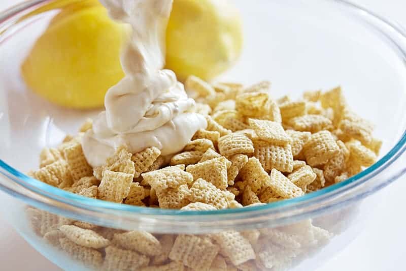 Pouring Chocolate over Cereal for Puppy Chow