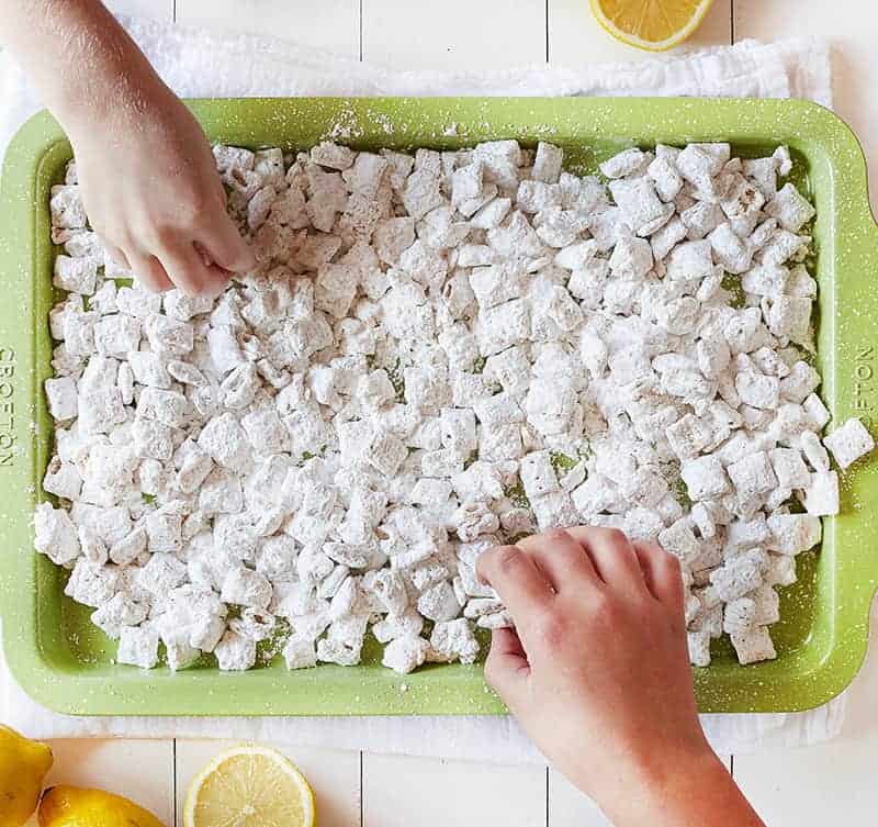 Children's hands Eating Lemon Puppy Chow