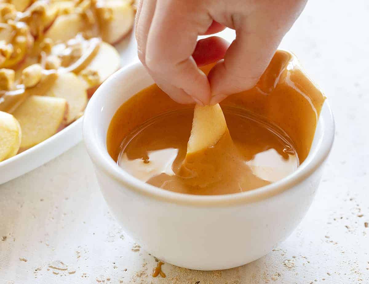 Dipping Apple Nachos in Peanut Butter