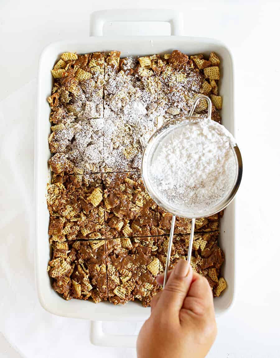 Puppy Chow Bars Sprinkled with Confectioners Sugar