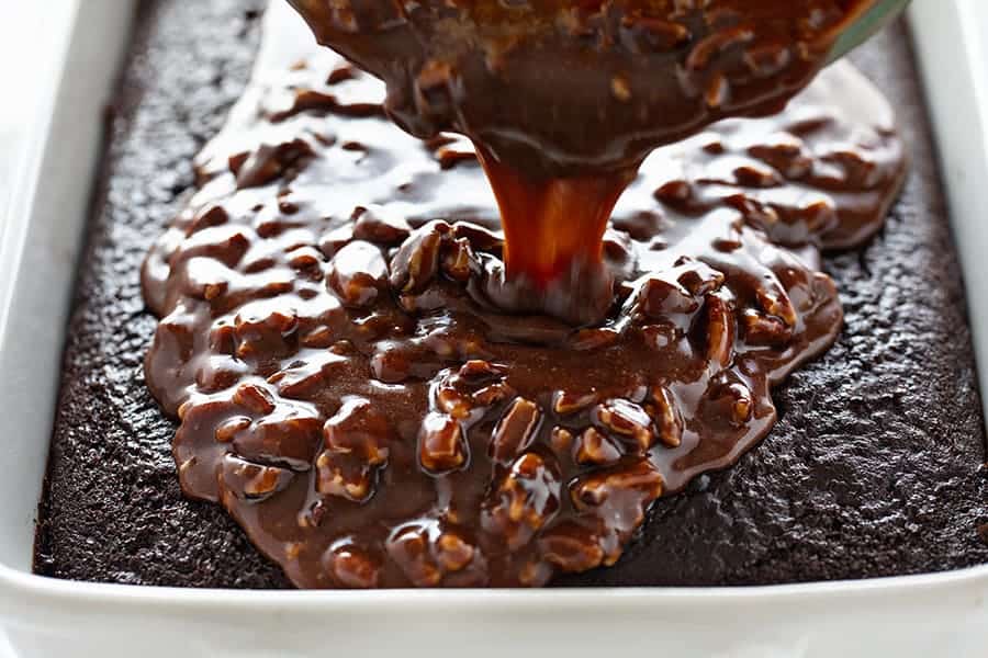 Frosting Poured Onto a Chocolate Cake