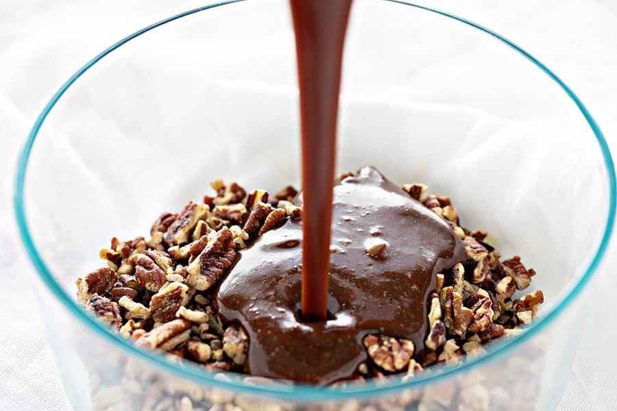 Pouring Frosting Over Pecans