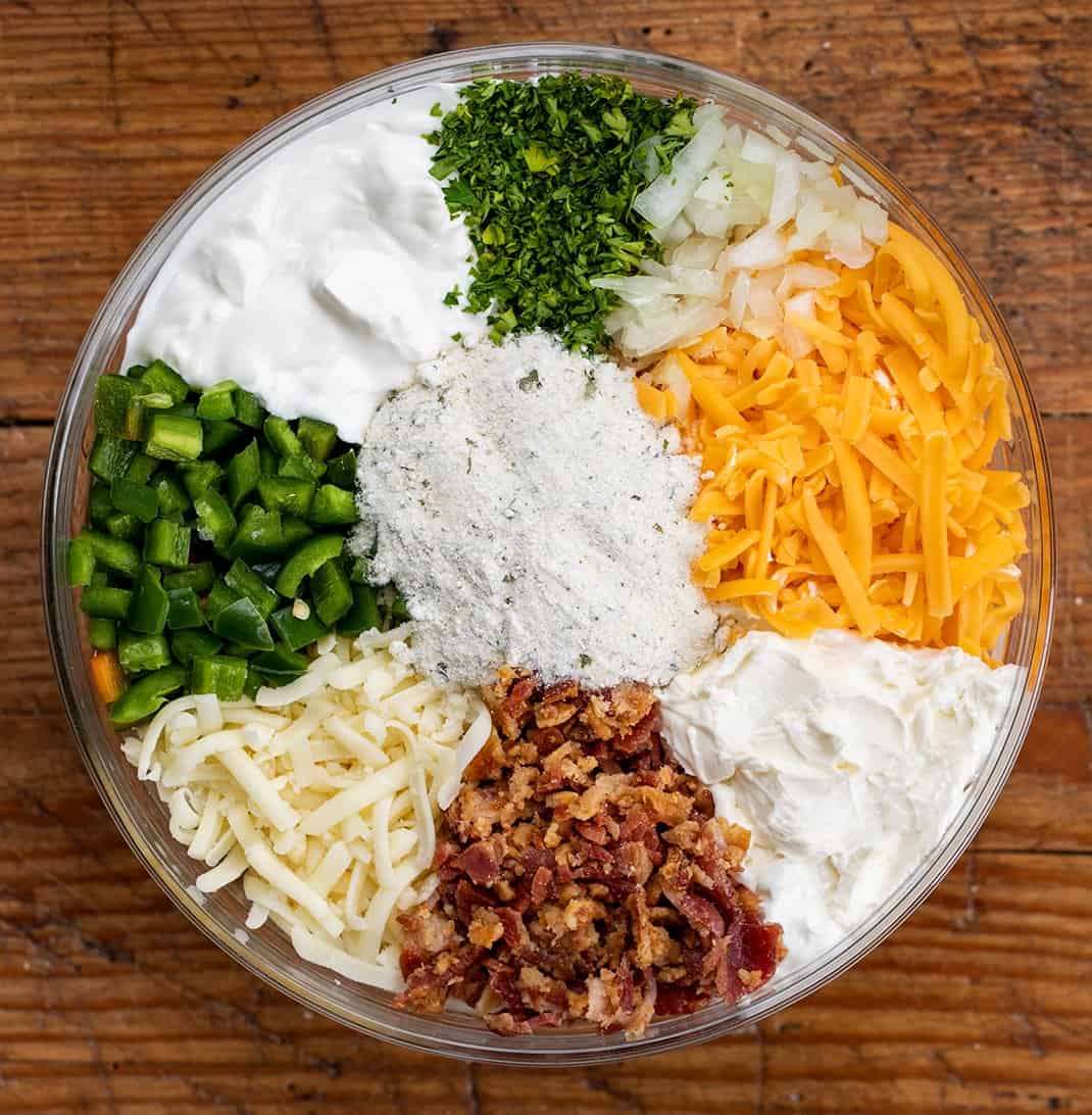 Ingredients for Jalapeno Popper Dip in a Bowl Sectioned Off