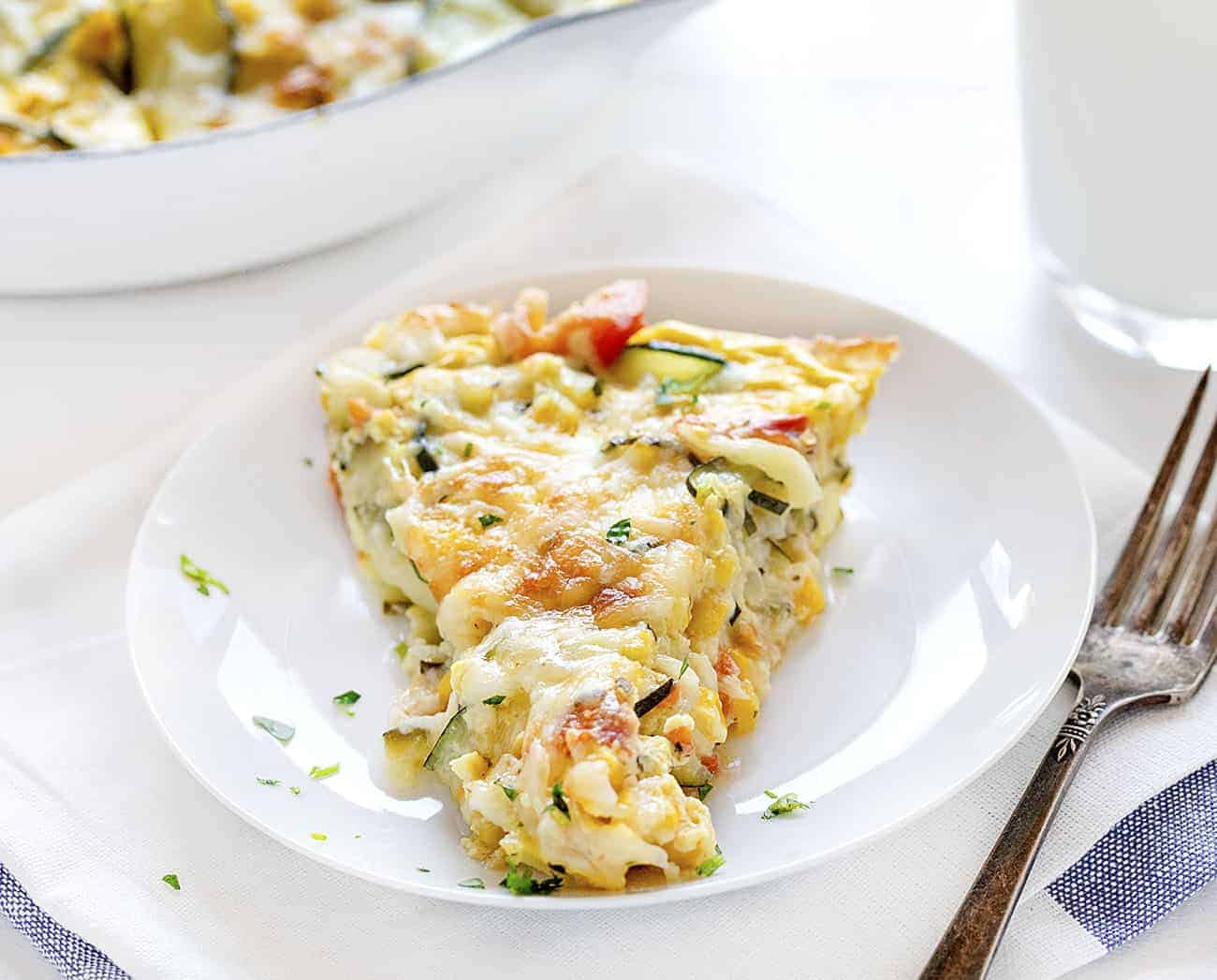One Piece of Zucchini and Corn Quiche on a Plate