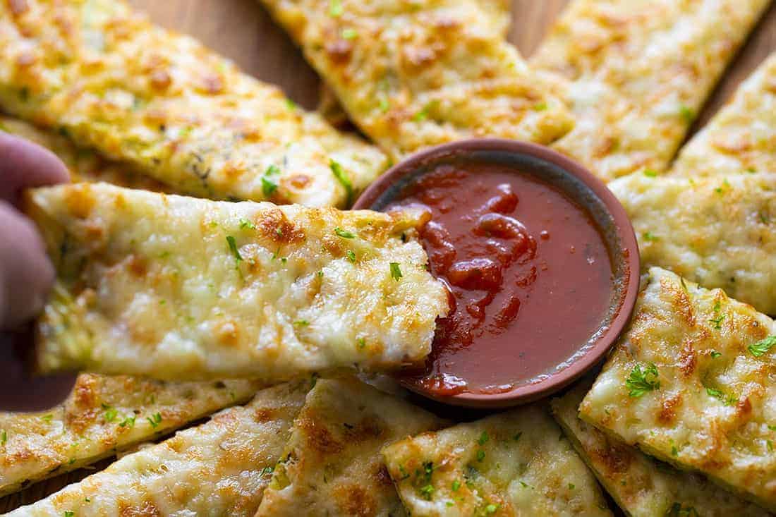 cheesy zucchini breadsticks sipped in red sauce