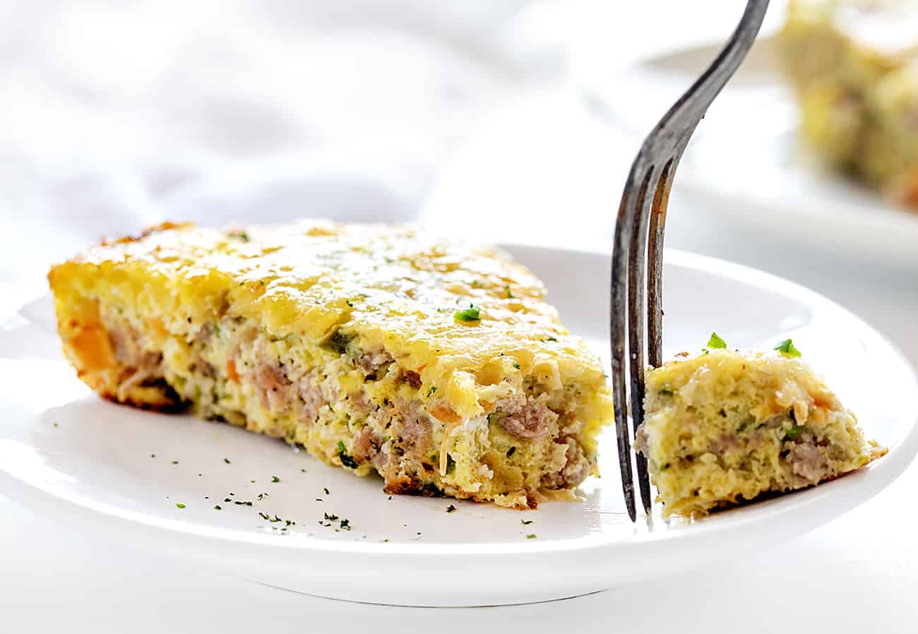 Cutting a bite from Sausage and Zucchini Breakfast Skillet