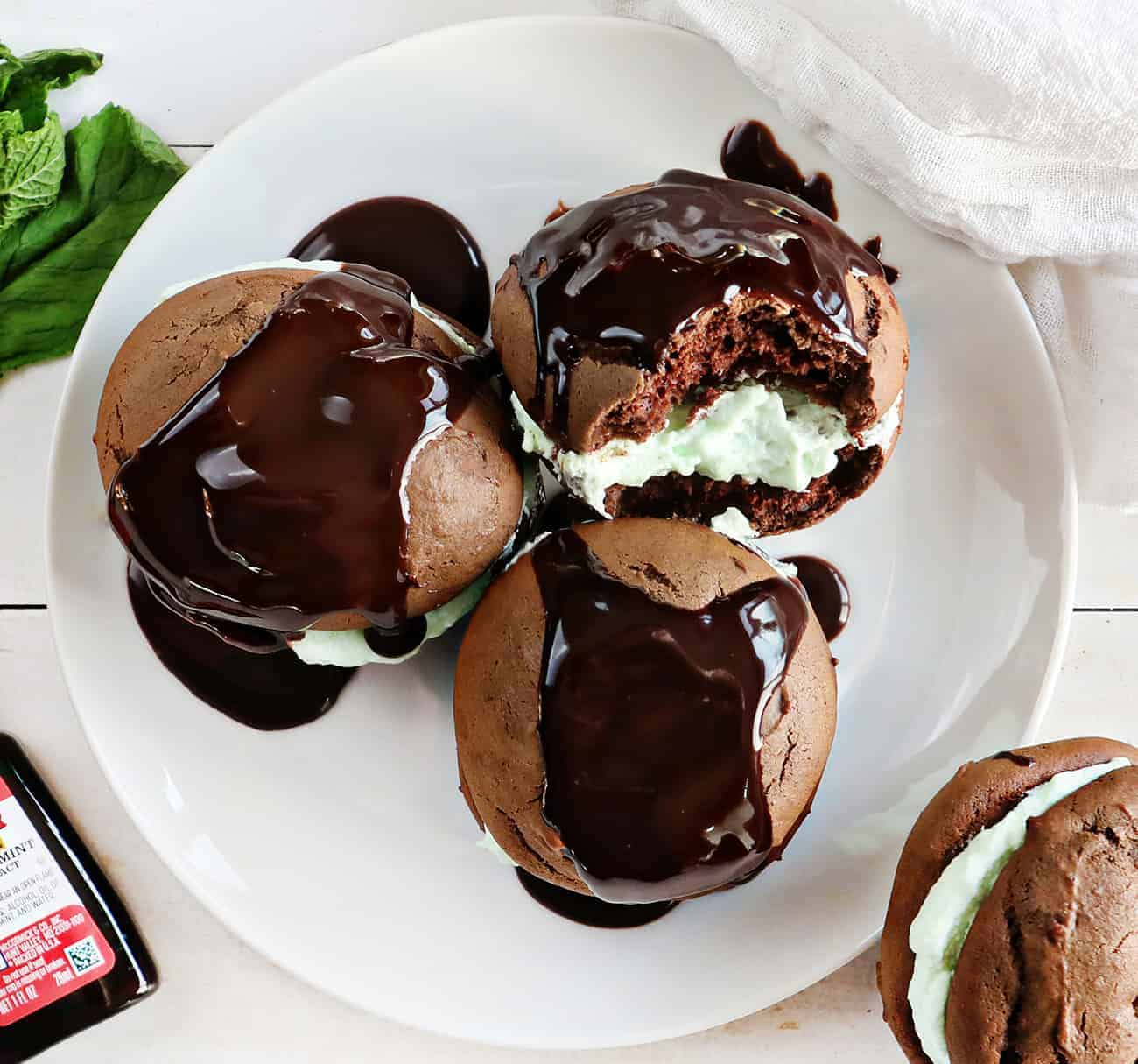 Plate of Peppermint Whoopie Pies covered in Chocolate Sauce