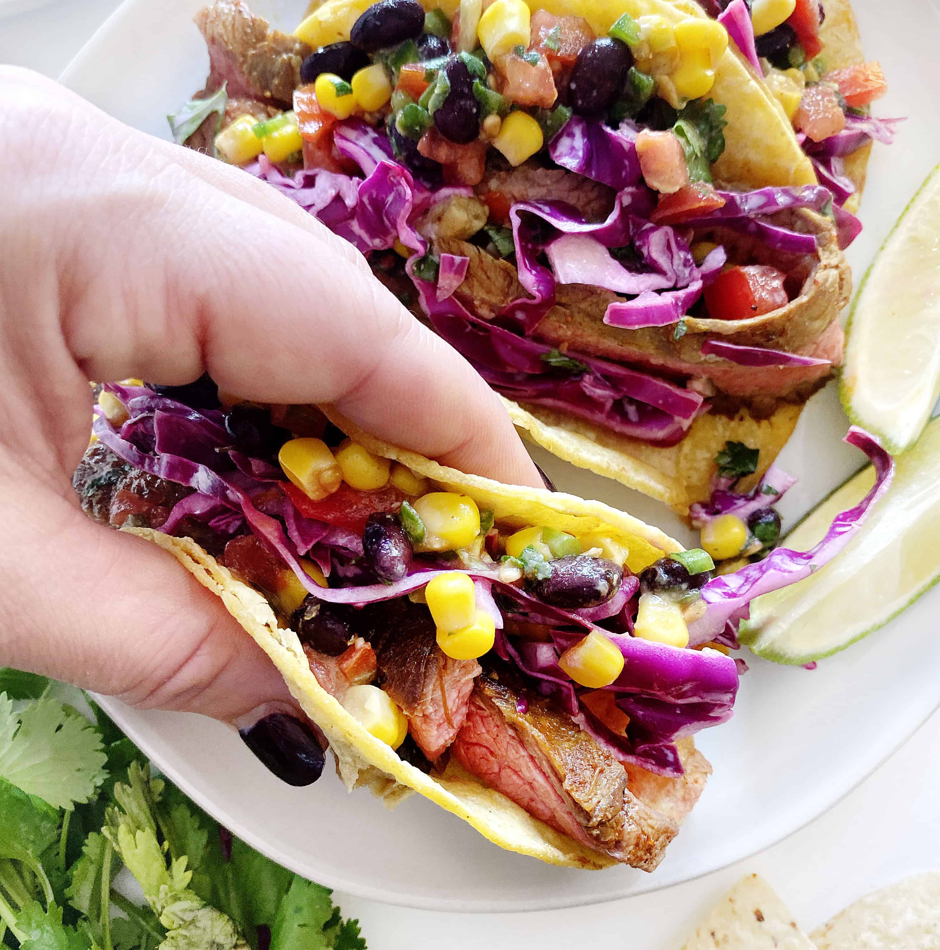 Hand holding Heart Healthy Steak Tacos