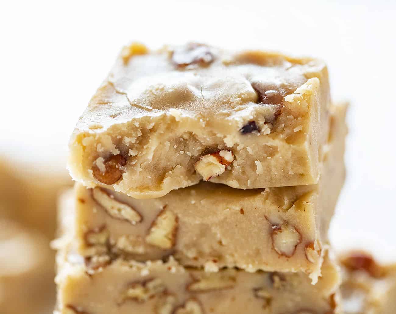 Close up of piece of Butter Pecan Fudge with bite taken out