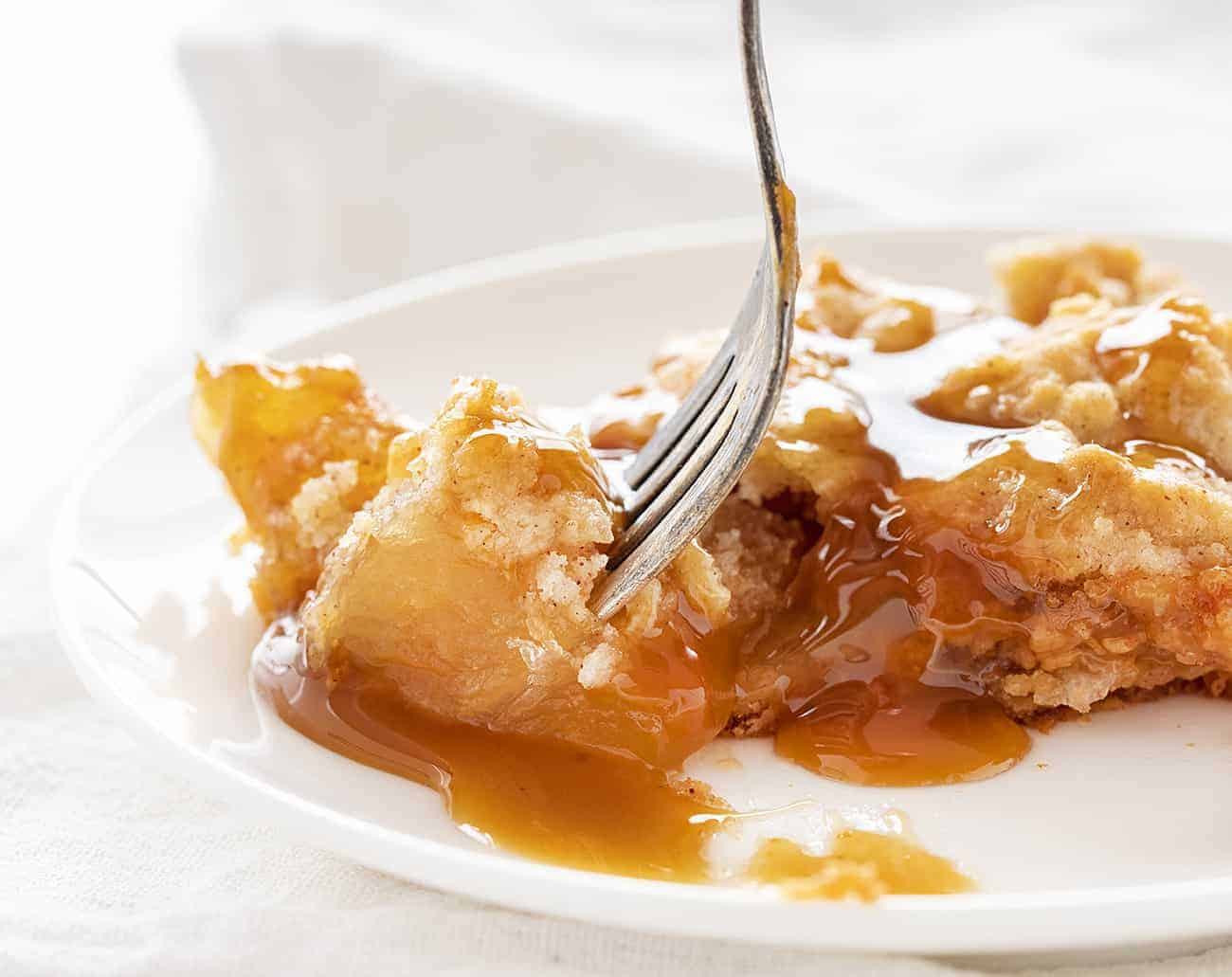 Taking a bite of Caramel Apple Dump Cake