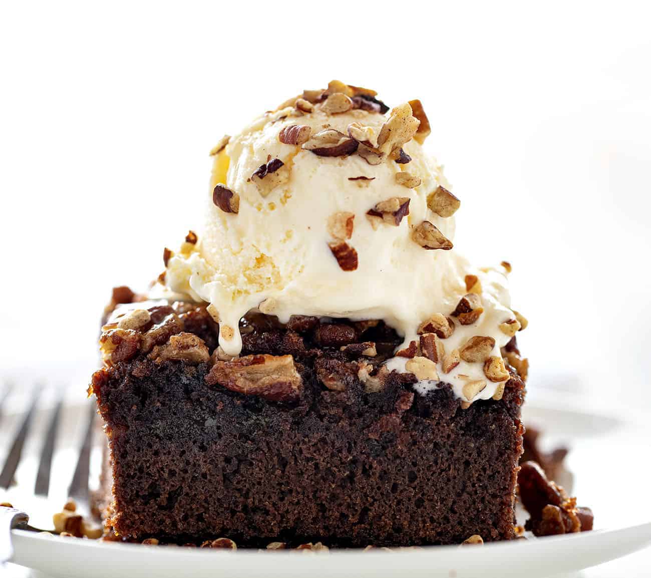 PIece of Ooey Gooey Pecan Brownies with Ice Cream on Top