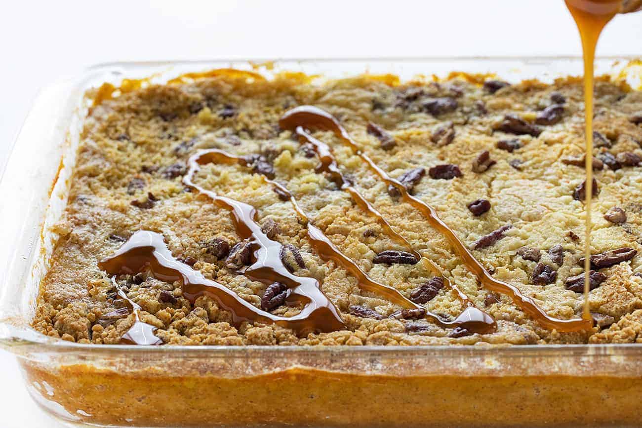 Drizzling Caramel over Pumpkin Pecan Dump Cake