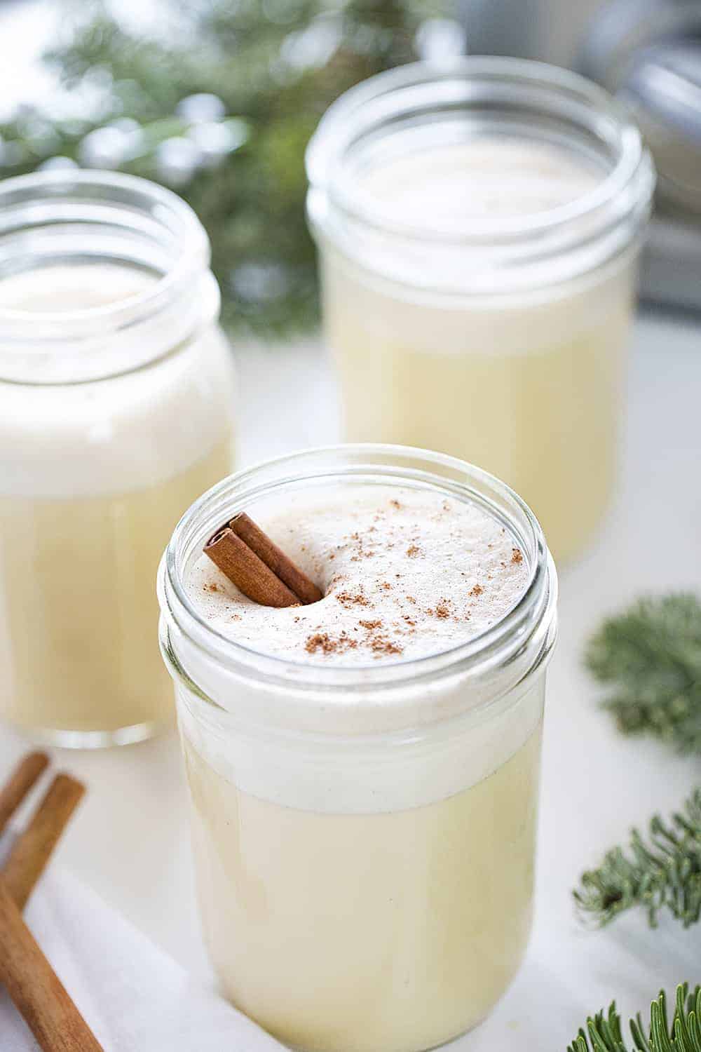 Easy Blender Eggnog Recipe with 3 Jars and a Cinnamon Stick