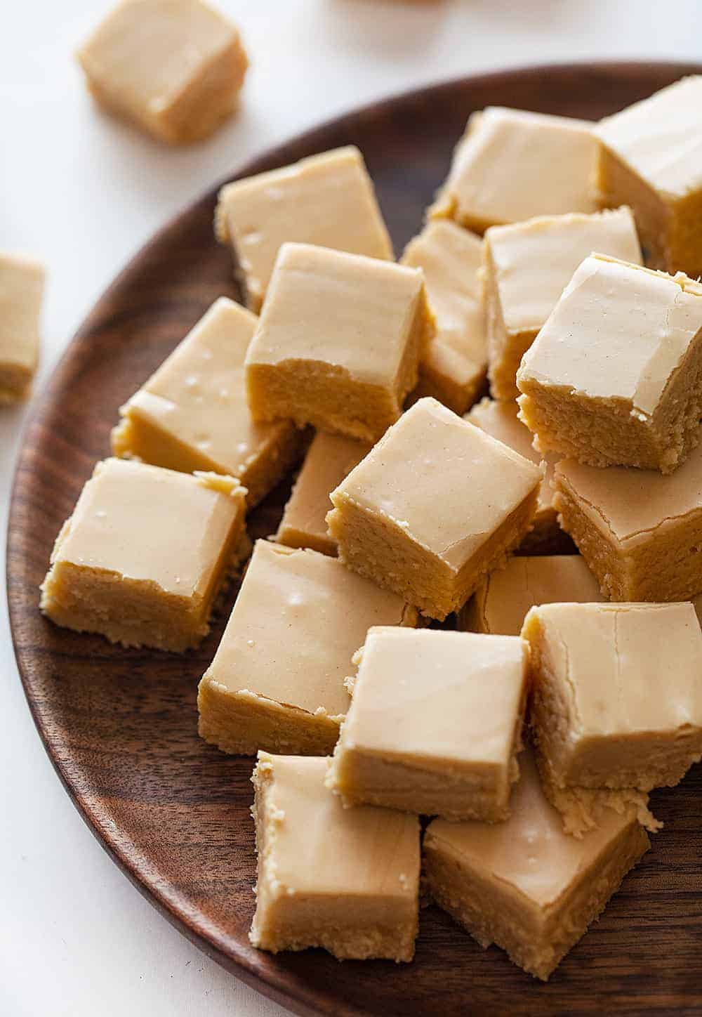 Creamy Peanut Fudge Pieces on a Wood Plate