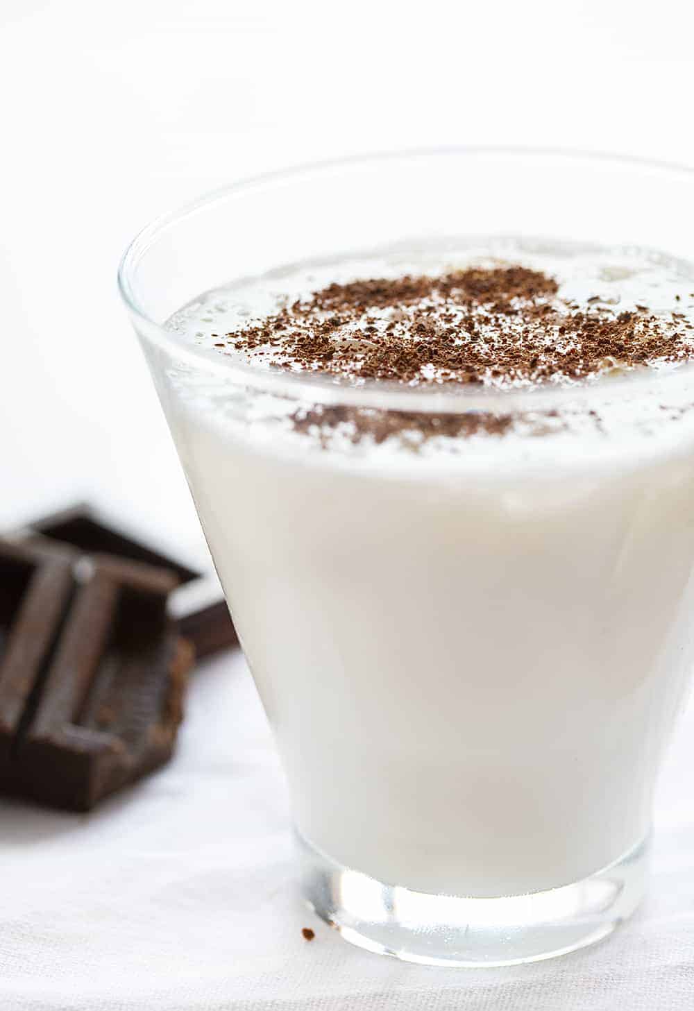 White Chocolate Martini with Shaved Chocolate on top and chocolate in background