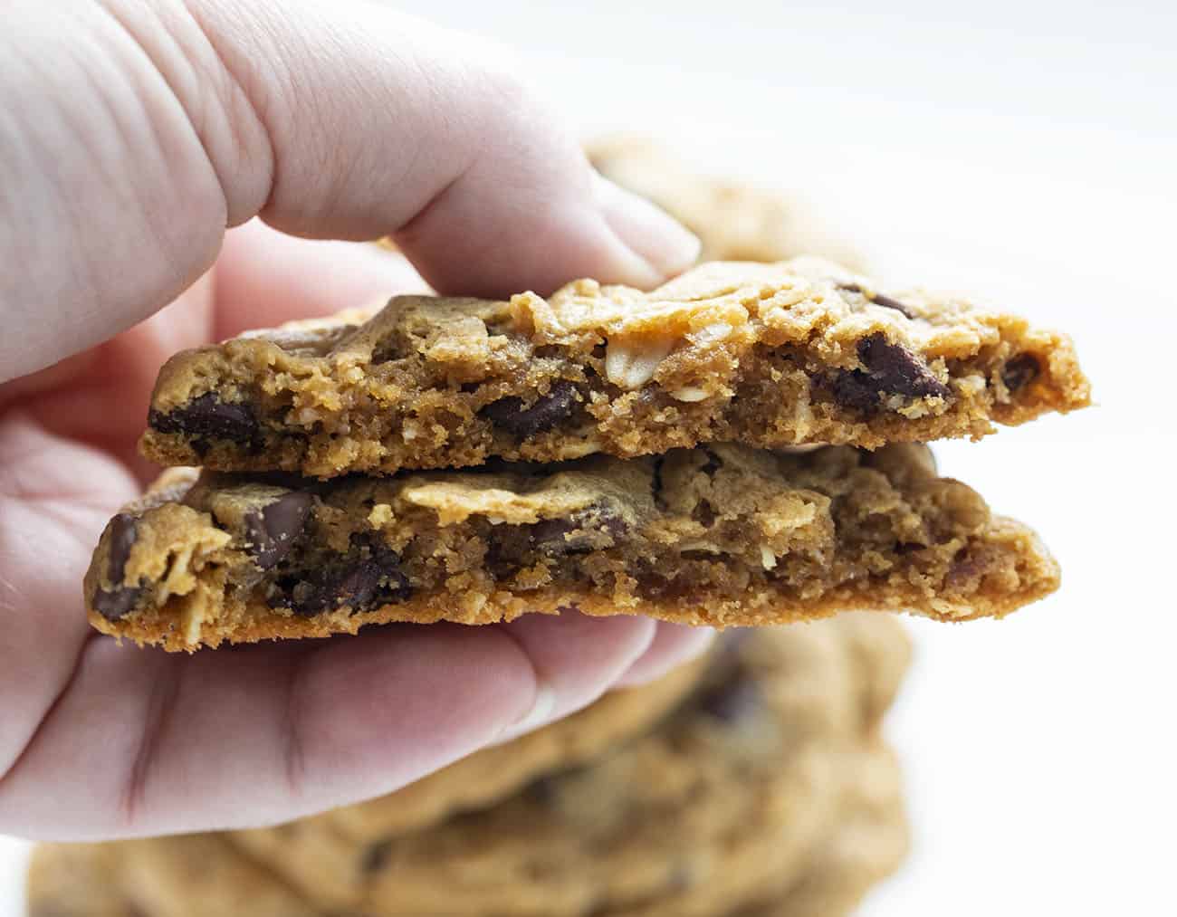 Broken Flourless Peanut Butter Chocolate Chip Cookie Held in Hand