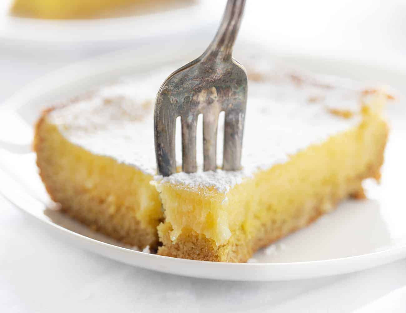 Fork Taking Piece of Lemon Ooey Gooey Cake 